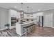 Stylish kitchen boasts a center island with seating, stainless steel appliances and modern light fixtures at 19414 Mcbee Ave, Westfield, IN 46074