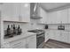 Modern kitchen with stainless steel appliances, white cabinets, and subway tile backsplash at 19414 Mcbee Ave, Westfield, IN 46074