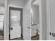 A stacked washer and dryer are featured within the laundry area at 19414 Mcbee Ave, Westfield, IN 46074