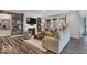 Cozy living room with fireplace, built-in shelves, and a large window at 19414 Mcbee Ave, Westfield, IN 46074