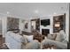 Comfortable living room featuring a fireplace, wood accent wall, and neutral décor at 19414 Mcbee Ave, Westfield, IN 46074