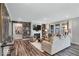 Inviting living room boasts a fireplace, wood-look flooring, and natural light at 19414 Mcbee Ave, Westfield, IN 46074