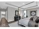 Stylish main bedroom with tray ceiling, neutral color scheme, and ample natural light at 19414 Mcbee Ave, Westfield, IN 46074