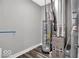 Utility room features a water heater and furnace on modern wood look floors at 19414 Mcbee Ave, Westfield, IN 46074