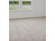 Bright bedroom with a pleasant view of a serene pond visible through large windows at 1976 White Oak Ln, Shelbyville, IN 46176