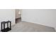 Bedroom with neutral carpet, white walls, and minimal staging, offering a blank canvas at 1976 White Oak Ln, Shelbyville, IN 46176