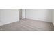 Spacious carpeted bedroom with ample natural light, neutral walls and an open doorway at 1976 White Oak Ln, Shelbyville, IN 46176
