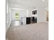 Open-concept living area featuring a kitchen with a breakfast bar, dark cabinets and plenty of light at 1976 White Oak Ln, Shelbyville, IN 46176