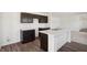 Kitchen with granite countertops, wood cabinets and a central island with a sink at 1976 White Oak Ln, Shelbyville, IN 46176