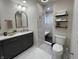 Modern bathroom with vanity, stylish mirror, and tiled shower, creating a spa-like retreat at 2029 Winton Ave, Indianapolis, IN 46224