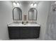 Elegant bathroom with double vanity, sleek mirrors, and modern fixtures, enhancing the design at 2029 Winton Ave, Indianapolis, IN 46224