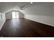 Spacious bedroom featuring a vaulted ceiling, ceiling fan and sliding door to deck at 2029 Winton Ave, Indianapolis, IN 46224