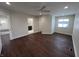 Spacious bedroom features hardwood floors, a ceiling fan, and plenty of natural light from the window at 2029 Winton Ave, Indianapolis, IN 46224