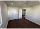 Bedroom features hardwood floors, a ceiling fan, and a closet with double doors at 2029 Winton Ave, Indianapolis, IN 46224