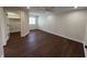 Bright bedroom featuring hardwood floors, natural light, and a walk-in closet at 2029 Winton Ave, Indianapolis, IN 46224