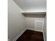 Walk-in closet featuring a hanging rod and storage cubby at 2029 Winton Ave, Indianapolis, IN 46224