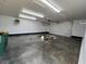 Shot of the inside of the garage featuring concrete floors, white walls, and an insulated garage door at 2029 Winton Ave, Indianapolis, IN 46224