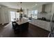 Bright kitchen with granite countertops, a large island, stainless steel appliances, and upgraded fixtures at 2029 Winton Ave, Indianapolis, IN 46224