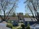 View of the quiet neighborhood with mature trees and well-maintained homes at 2029 Winton Ave, Indianapolis, IN 46224
