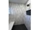 Tiled shower with sleek fixtures, built-in bench, and accent window, offering a luxurious experience at 2029 Winton Ave, Indianapolis, IN 46224