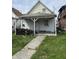Charming bungalow with covered porch and small yard awaiting your personal touch at 2157 S Meridian St, Indianapolis, IN 46225