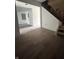 Bright living room features hardwood floors and staircase leading to upper level at 2157 S Meridian St, Indianapolis, IN 46225