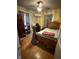 Bedroom featuring a bed, hardwood floors, and unique decor at 216 Golf Club Rd, Anderson, IN 46011