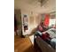 Cozy bedroom featuring hardwood floors, a ceiling fan, and closet with louvered doors at 216 Golf Club Rd, Anderson, IN 46011