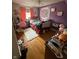 A decorated bedroom with hardwood flooring and vintage furniture at 216 Golf Club Rd, Anderson, IN 46011