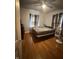 Bedroom showcasing hardwood floors and natural lighting at 216 Golf Club Rd, Anderson, IN 46011