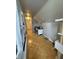 Long hallway features built-in bookshelves and a unique parquet wood floor at 216 Golf Club Rd, Anderson, IN 46011
