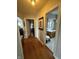 Hallway view with hardwood floors leading to rooms at 216 Golf Club Rd, Anderson, IN 46011