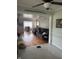Cozy living room with hardwood floors, a fireplace, and a view into the adjacent dining area at 216 Golf Club Rd, Anderson, IN 46011