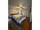 Comfortable main bedroom features hardwood floors, neutral tones, and a ceiling fan at 216 Golf Club Rd, Anderson, IN 46011