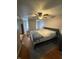 Comfortable main bedroom features hardwood floors, neutral tones, and a ceiling fan at 216 Golf Club Rd, Anderson, IN 46011