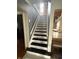 Stairway with decorative messages on the treads at 216 Golf Club Rd, Anderson, IN 46011