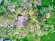 Overhead view of a house with mature trees, a lush garden, and a private driveway at 2215 W State Rd, Pendleton, IN 46064