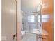 Compact bathroom features tiled shower, pedestal sink, and toilet in a functional layout at 2215 W State Rd, Pendleton, IN 46064