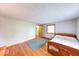 Bedroom features hardwood floors, natural light, and a walk-in closet for ample storage space at 2215 W State Rd, Pendleton, IN 46064
