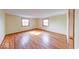 Bright bedroom boasts hardwood floors and natural light from two windows, creating a cozy atmosphere at 2215 W State Rd, Pendleton, IN 46064