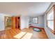 Bedroom with hardwood floors, large windows, and custom-built shelving for organization at 2215 W State Rd, Pendleton, IN 46064
