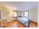 Bedroom boasts hardwood floors and natural light, creating a peaceful atmosphere for rest and relaxation at 2215 W State Rd, Pendleton, IN 46064