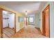 Hallway with hardwood floors transitioning into carpeted area, connecting different spaces in the home at 2215 W State Rd, Pendleton, IN 46064