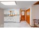 Functional kitchen featuring white cabinets, marble tile floors, and stainless steel appliances at 2215 W State Rd, Pendleton, IN 46064
