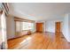 Bright living room featuring gleaming hardwood floors, a large window, and classic trim at 2215 W State Rd, Pendleton, IN 46064