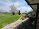 Beautiful backyard with expansive lawn, rock garden, and outdoor seating area at 2227 S County Road 300 E, Danville, IN 46122