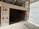 Interior of a barn featuring horse stalls and sliding gate at 2227 S County Road 300 E, Danville, IN 46122