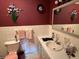 Traditional bathroom with vanity, mirror, and wall decorations at 2227 S County Road 300 E, Danville, IN 46122