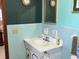 Bathroom includes a single sink vanity with blue tile backdrop at 2227 S County Road 300 E, Danville, IN 46122