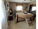 Bedroom with a decorative bed, wall decor, and stairs for pets at 2227 S County Road 300 E, Danville, IN 46122